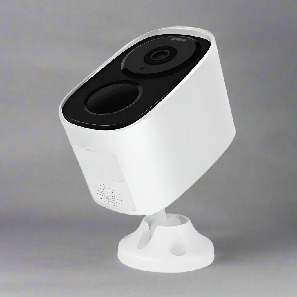 White security camera with black top on a white background