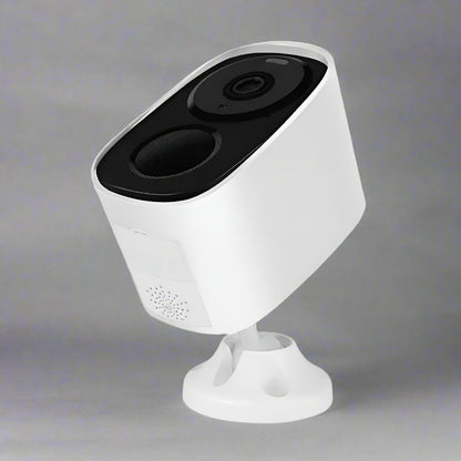 White security camera with black top on a white background