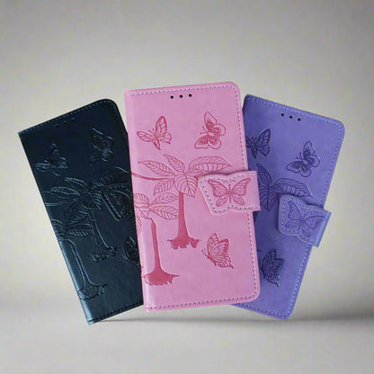 Three phone cases in black, pink, and purple with butterfly designs on a light gray background.